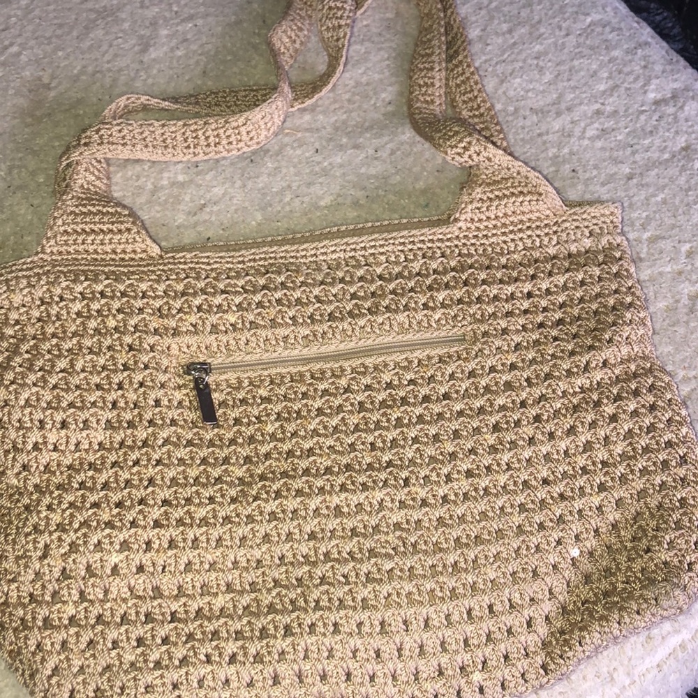 Tan purse. The sak.